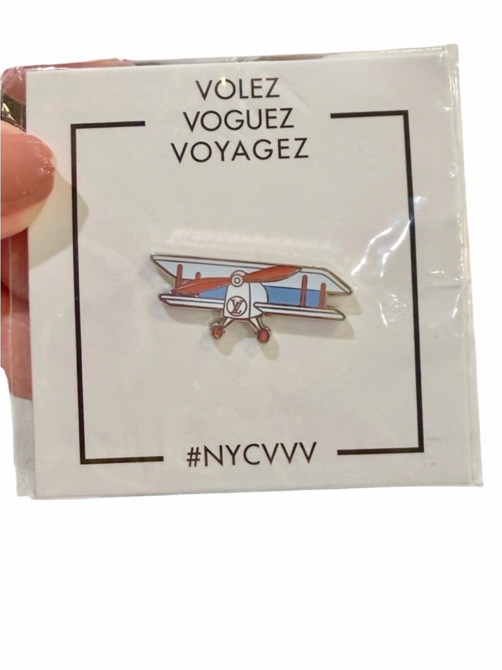 Louis Vuitton Enamel pintrill titled 'Volez Voguez Voyagez' by